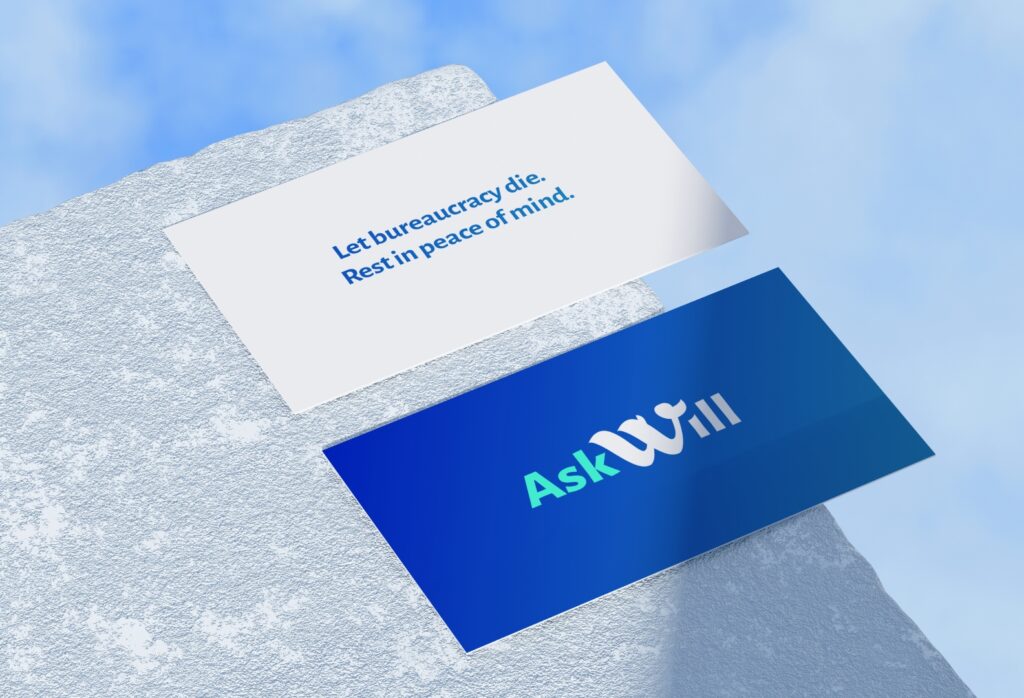 Business card with AskWill logo and legal quote on a textured surface.